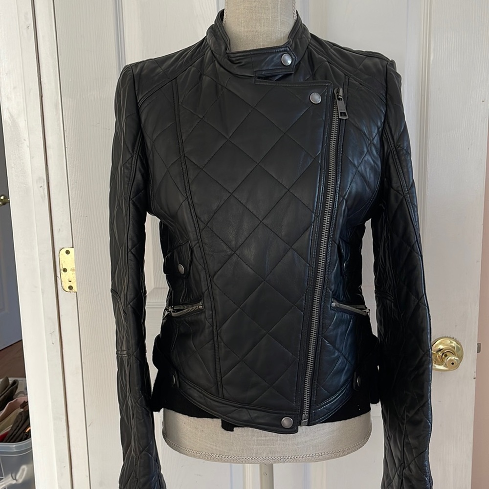 Burberry waist-length black leather jacket.